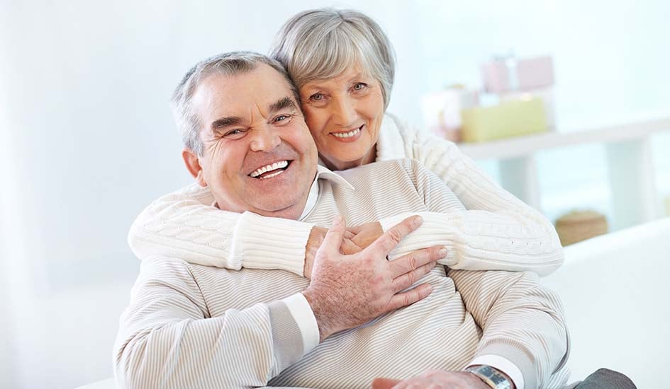 advantages-of-choosing-all-on-4-implants-old-couple-sweet-hug-smile-happy