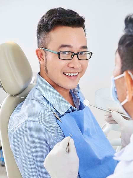 cheerful-asian-man-dentist-check-up-smile-oral-health