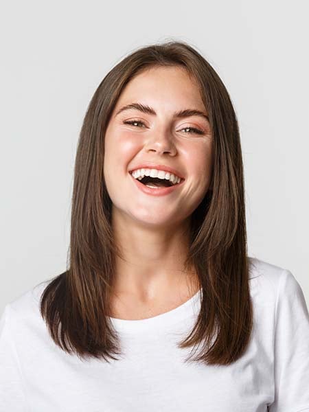 close-up-happy-brunette-girl-white-t-shirt-laughing-smiling-carefree-camera-dental-care-oral-health