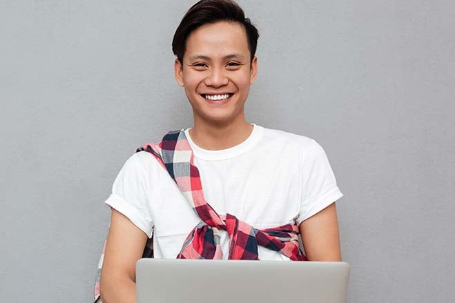 conventional-or-traditional-bridges-smile-dental-care-oral-health-handsome-young-boy-college-laptop-study-happy-cheerful-fun