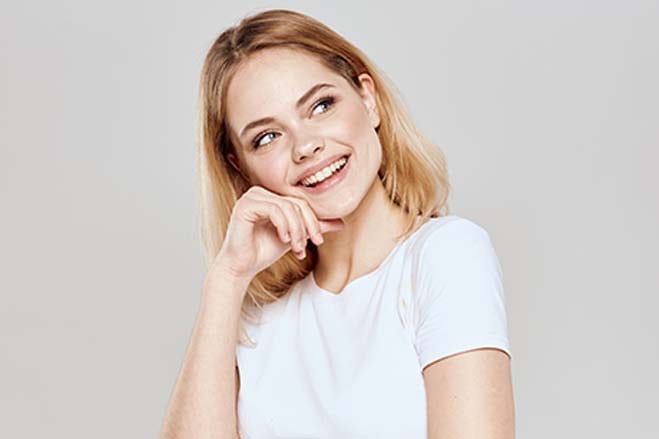 discreet-white-girl-smiling-happy-cheerful-show-teeth-oral-health-dental-care