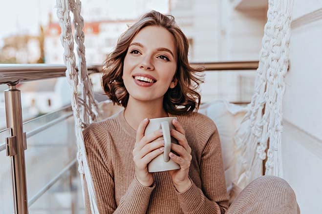 increased-comfort-beautiful-girl-smile-happy-enjoy-hot-coffee-oral-health-dental-care