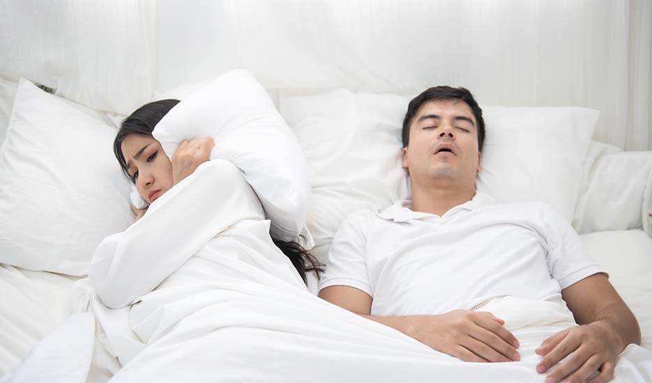 what-is-sleep-apnea-couple-sleeping-man-snoring-girl-unhappy-breath-health