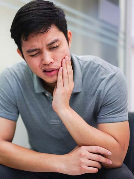 wisdom-tooth-surgery-asian-boy-feelling-pain-dental-care