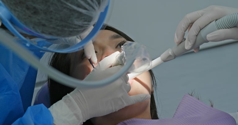 Patient receiving a professional dental cleaning to help prevent gum disease