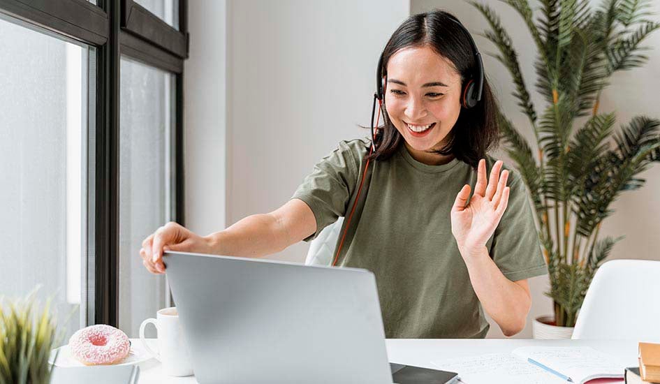 woman-with-headset-having-video-call-laptop-1