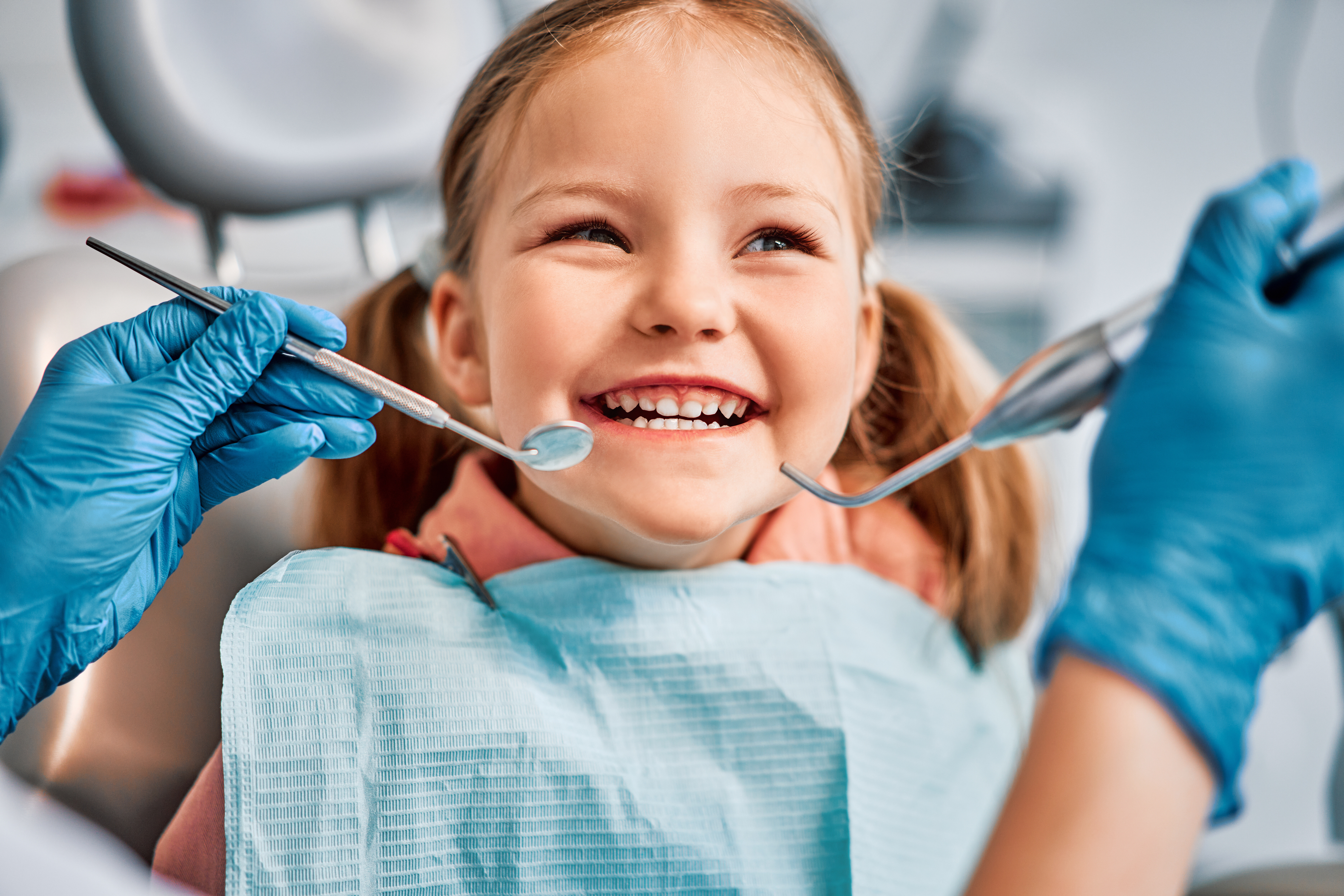 Childrens dentistry. Live funny photo of a laughing child at the dentists appointment.