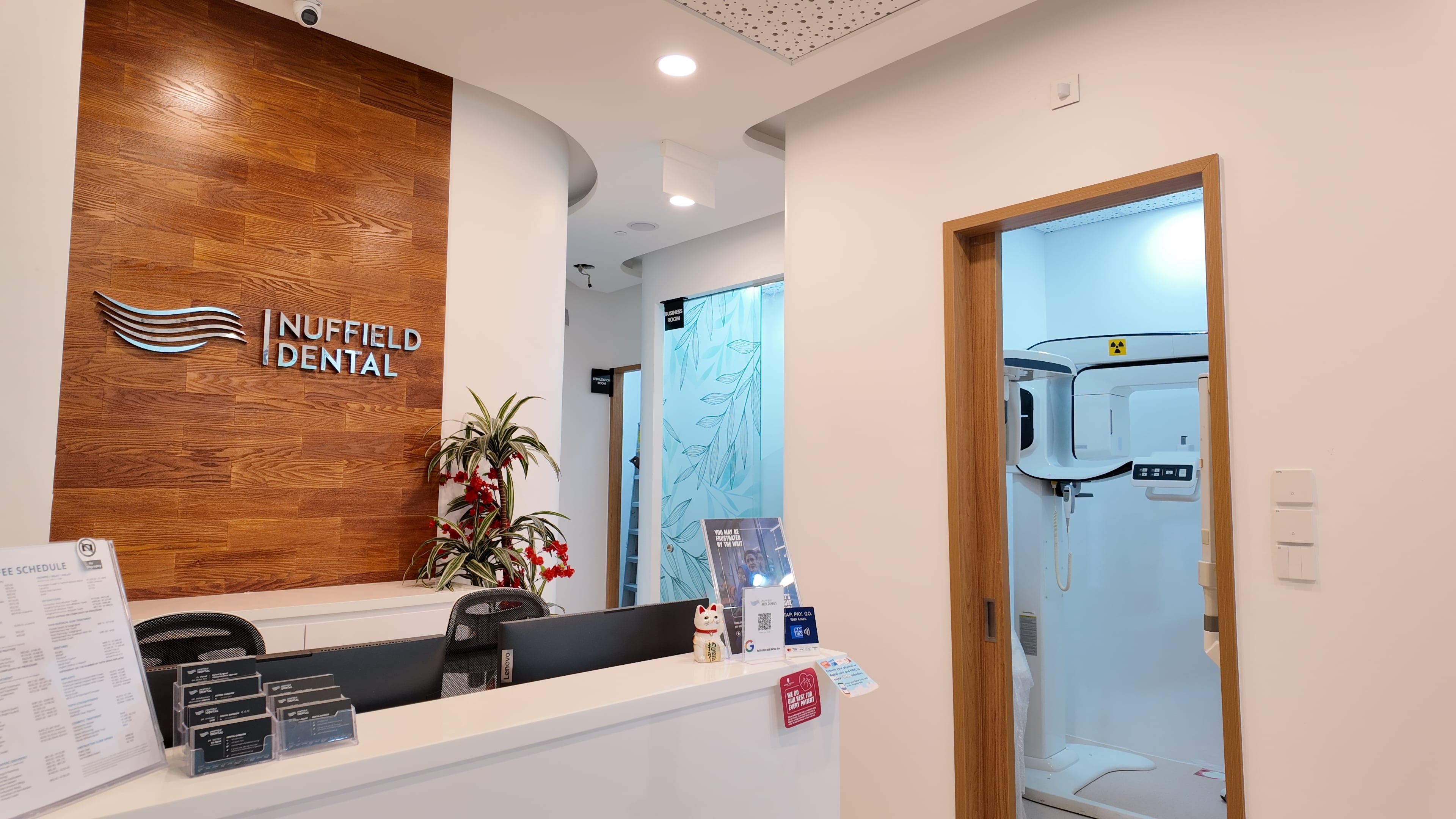Clinic reception signage at Nuffield Dental Marina One, Singapore.