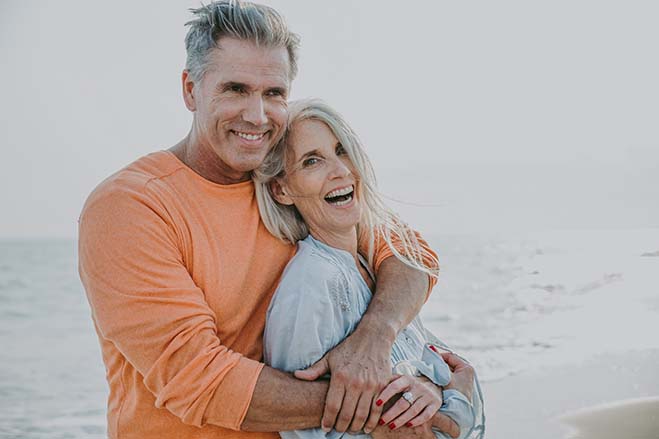 better-life-quality-old-couple-sweet-beach-happy-smile-enjoy-dental-care-oral-health-hug