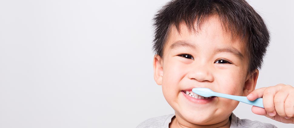 child brushing teeth