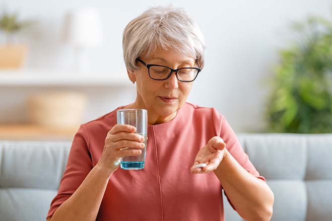 excescsive-gag-reflex-old-woman-taking-medicine-dental-care-oral-health-drink-water