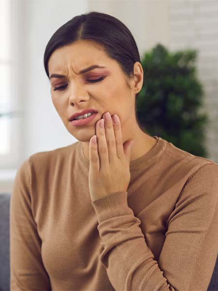 swollen-or-bleeding-gums-woman-feeling-pain-dental