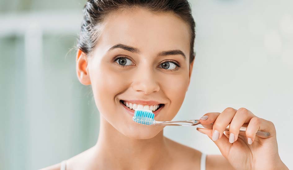 woman brushing teeth