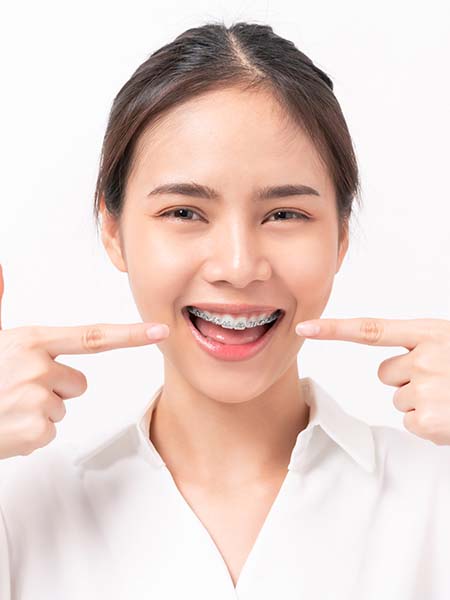 types-of-damon-braces-smiling-asian-girl-happy-dental-care-check-up-oral-health